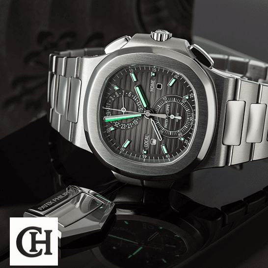 Patek Philippe Nautilus Travel Time Chronograph 5990/1A-001 First-Class patek philippe nautilus 59901A 001 tiltedleft Patek Philippe Geneve Black Dial Steel Case dial phosphor