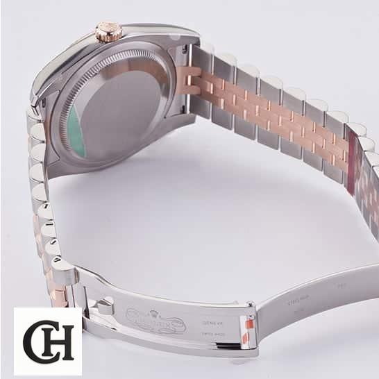 Rolex Datejust 36 116231 Two Tone Jubilee Bracelet Open Fold Clasp on the table