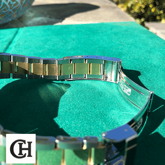 Rolex Submariner 16613 Rolex Submariner 16613 Two Tone Stainless Steel Gold Diamond on the table