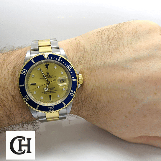 Rolex Submariner 16613 Rolex Submariner 16613 Yellow Gold Dial Blue Bezel on his arm