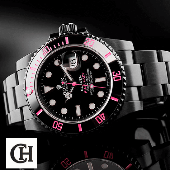Rolex Blaken Submariner Pink Bezel and Black Dial on the table