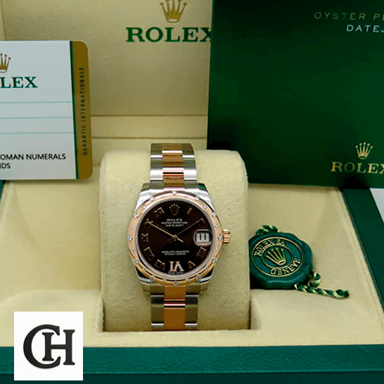 Rolex Datejust 178341 Superior Rolex Datejust178341 Chocolate Roman warranty card in the box next to it