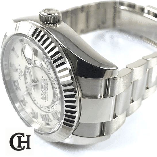 Rolex Sky-Dweller 326939 Rolex Sky-Dweller White Dial 326939 Fluted Bezel Oyster on the table