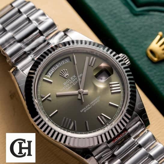 Rolex Day-Date 228239-0033 Rolex Day-date 228239-0033 Olive green dial above the rolex box