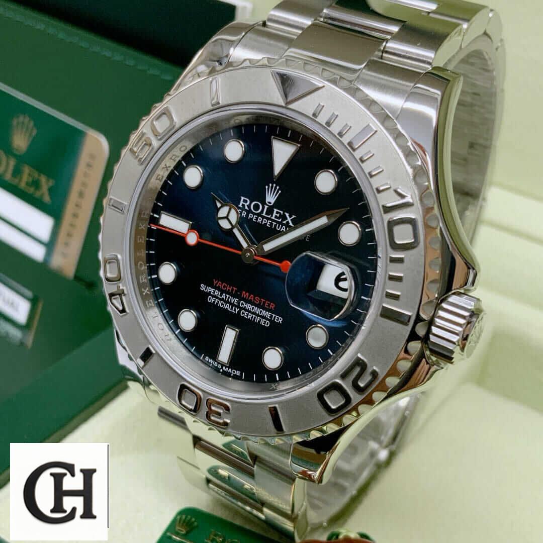 Rolex 116622 Yacht Master Oyster next to warranty card