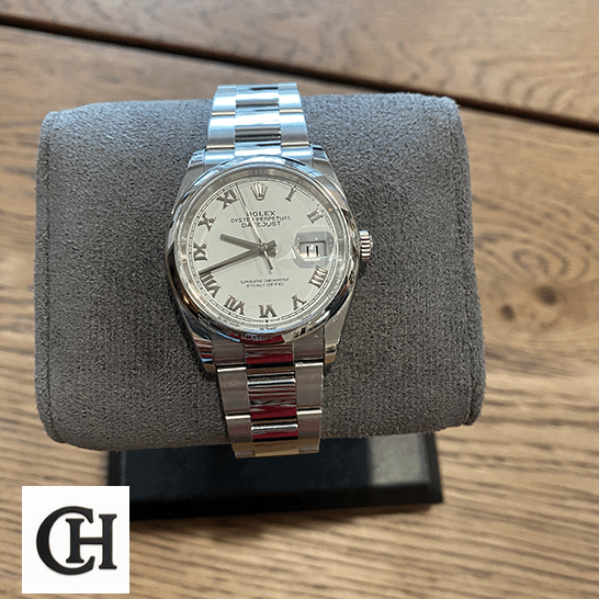 Rolex Datejust 126200-0008 White Dial rolex datejust 126200 0008 bezel Rolex Datejust 126200-0008 white dial with gray stand