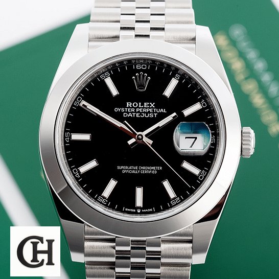 Rolex Datejust 118239 Black Dial Mirror Rolex Datejust 11823 Black Dial Steel Jubilee next to warranty card