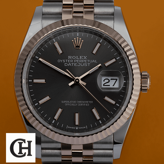Rolex Datejust 126231 Two-Tone Fluted Bezel Detailed rolex datejust 126231 steel gold automatic grey dial jubilee left Rolex Datejust 126231 Steel Gold Grey Dial orange background
