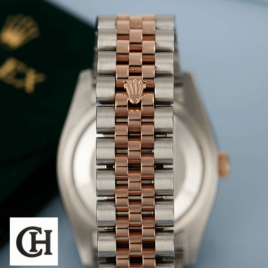 Rolex Datejust 126331-0010 "Sundust" Precision Rolex Datejust Sundust 126331-0010 Rose Gold and Silver Jubilee Bracelet on the Rolex Logo