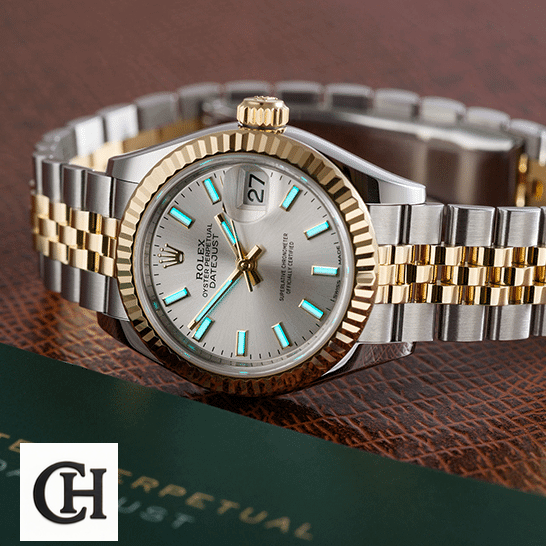 Rolex Datejust 126333-0002 Edition rolex datejust 126333 yellow gold steel silver dial jubilee left Rolex Datejust 126333 Jubilee Yellow Gold next to warranty card