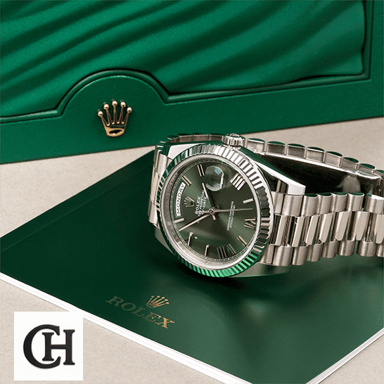 Rolex Day-Date 228239-0033 Rolex Day-Date 228239-0033 Romen Numerial Olive Green Dial in front of Rolex Box