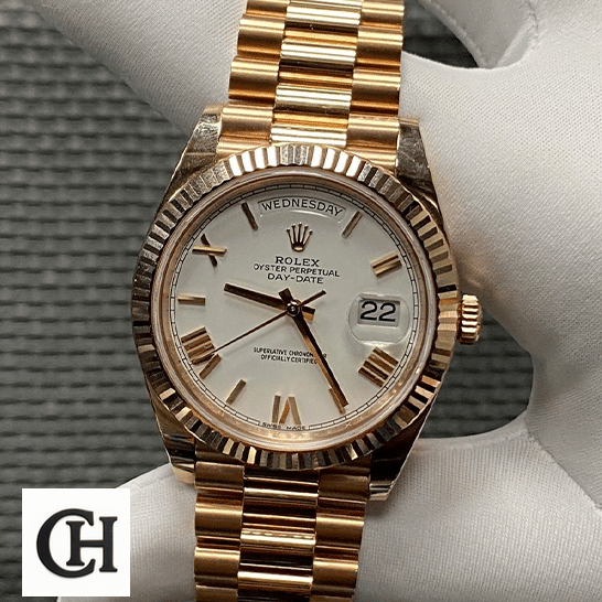Rolex Day-Date 228235 Roman Gold Oyster Bracelet on the hand