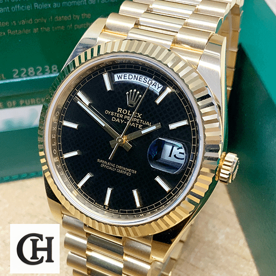 Rolex Day-Date 228235 beside the Rolex Box