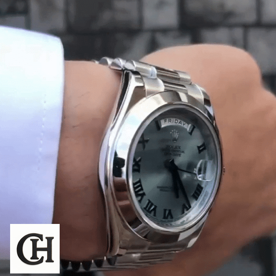 Rolex Day-Date 228206 the man has a Rolex Day-Date II Stainless Steel Ice Blue Roman Dial 218206