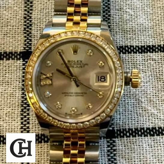 Rolex Lady-Datejust 279383RBR Champagne Diamond Master 1 9 Rolex Datejust 279383RBR-0003 Champagne & Diamond Dial Jubilee on the table