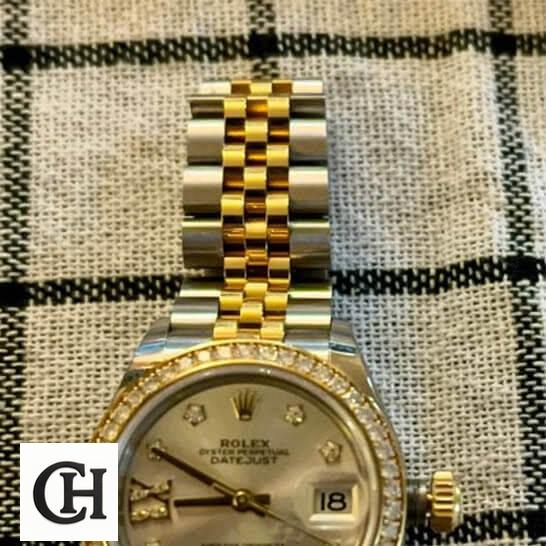 Rolex Lady-Datejust 279383RBR Champagne Diamond Master 6 2 Rolex Datejust 279383RBR-0003 Two Tone Jubilee Bracelet on the table