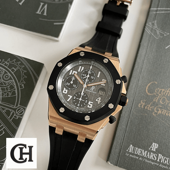 AP Royal Oak Offshore 25940OK.OO.D002CA.01 United Luxury Shop audemars piguet royal oak o ffshore 25940OK.OO.D002CA.01 front Audemars Piguet Siyah Kadran 25940OK.OO_.D002CA.01 Altın Kasa Replika garanti kartının yanında