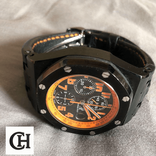 Audemars Piguet Royal Oak Offshore 26200SN.OO.D101CR.01 "Volcano" Detailed audemars piguet royal oak offshore 26200SN.OO.D101CR.01 tiltedright Audemars Piguet Royal Oak Orange Black Dial on the white carpet