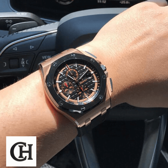 Audemars Piguet Royal Oak Offshore 26208ST.OO.D305CR.01 Audemars Piguet Black Bezel on the steering wheel on a man's wrist