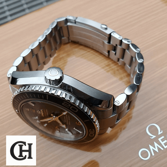 Omega Seamaster Planet Ocean Steel Crown & Bracelet on the omega box