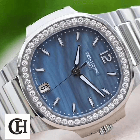 Patek Philippe Nautilus Ladies 7018/1A Elite Edition patek philippe nautilus 70181A tiltedright Patek Philippe Blue Dial Stainless Steel Diamond Bezel front view