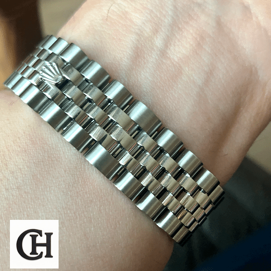 Rolex Datejust 279160 Pink Roman Dial Near Original Rolex Lady-Datejust 279160-0013 Jubilee Bracelet on his arm