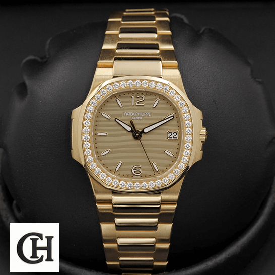 Patek Philippe Nautilus 7010/1R Patek Philippe Nautilus 70101R-012 Diamond Bezel Gold Bracelet black background