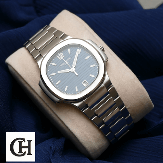 Patek Philippe Nautilus 7118/1A Ladies Perfect Duplicate patekphilippe nautilus 71181A 001 STEEL Patek Philippe Nautilus 71181A-001 Steel Bezel on the stand blue background