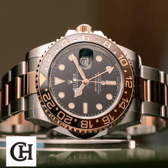Rolex GMT-Master II 126711CHNR "Root Beer" Deluxe Quality Rolex GMT-Master II Black Dial Ceramic Indices 126711CHNR-0002 on the table