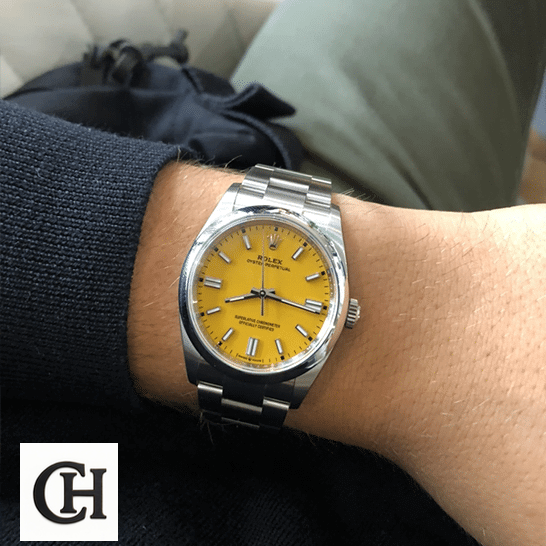 Rolex Oyster Perpetual 124300 Rolex Perpetual 124300 Yellow Dial Stick indices on his arm