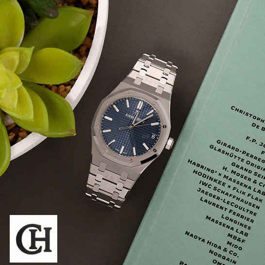 Audemars Piguet Royal Oak 15500ST Audemars Piguet Royal Blue Dial Steel Bezel next to flowers