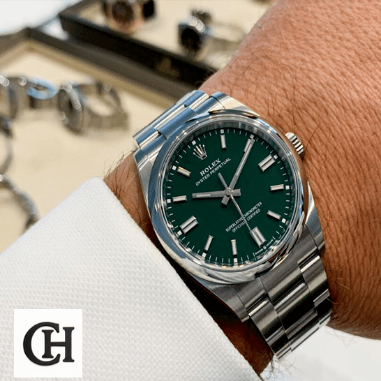 Rolex Datejust 126000 Oyster Perpetual Rolex Oyster Perpetual Green Dial 126000 on his arm