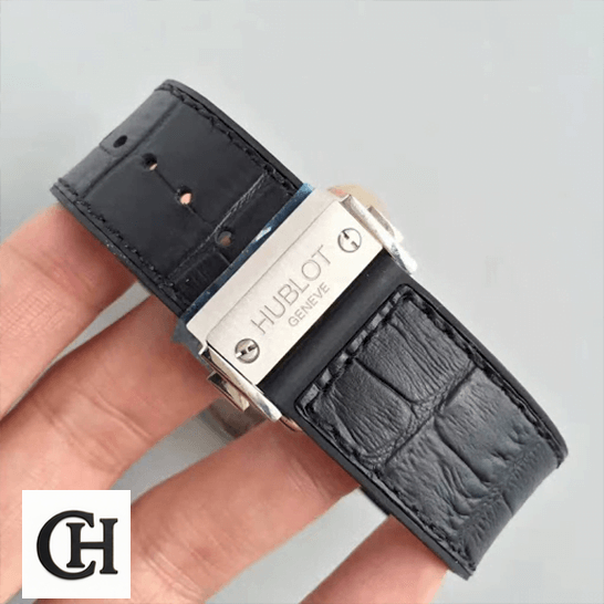 Hublot Geneve Classic Fusion Leather Black Bracelet on the hand grey background