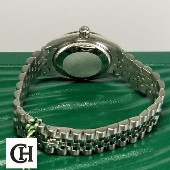 Rolex Datejust 126333 Rolex Datejust 220239 Jubilee Bracelet on Green Table top