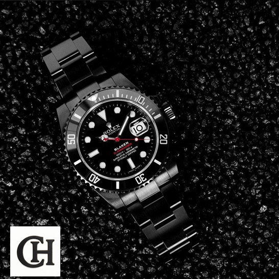 Rolex Submariner Date 116610N Rolex Blaken Submariner Black Dial on the asphalt