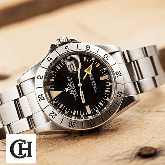 Rolex Explorer II 1655 "Steve McQueen" Vintage Handcrafted Rolex Explorer II 1655 (Antique) WARO025 Black Dial Oyster Bracelet on the table