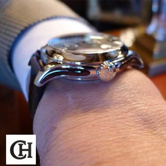 Patek Philippe Minute Repeater Tourbillon 5207P Patek Philippe Geneve Steel Case on the man wrist and crown on the logo