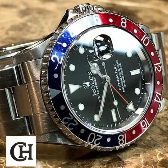 Rolex GMT-Master II 16710 Rolex Submariner GMT-Master II Red & Blue Bezel 16710 Oyster on the Table