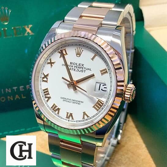 Rolex Datejust 126300 "White Roman Dial" Authentic rolex model 126231 replica1 Rolex Datejust 36 White Roman Dial Fluted Bezel