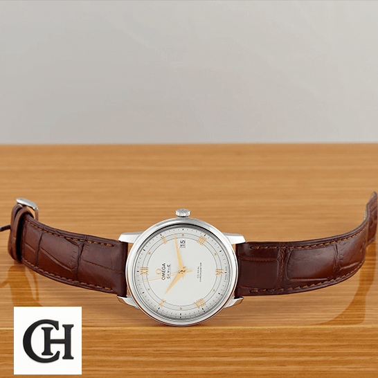 Omega De Ville Prestige 434.13.41.21.03.001 "Blue Dial" Supreme omega de ville prestige 424 13 40 20 02 002 side front Omega De Ville Prestige White Dial Brown Leather Bracelet on the table