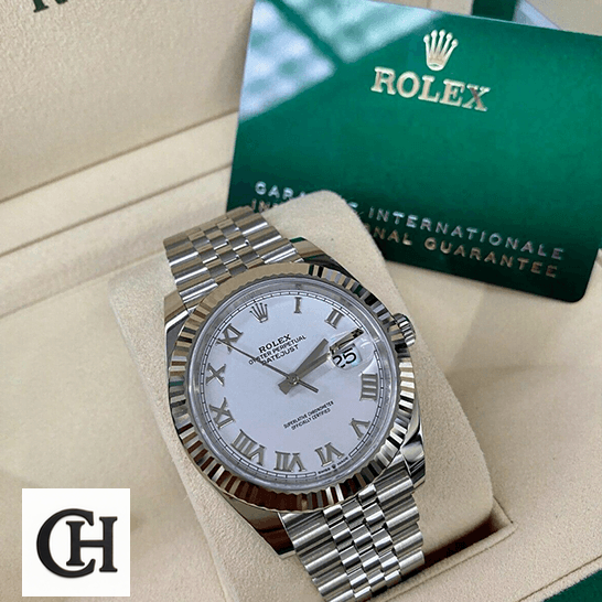 Rolex Datejust Roman 126334 White Dial in the rolex box and warranty card next to