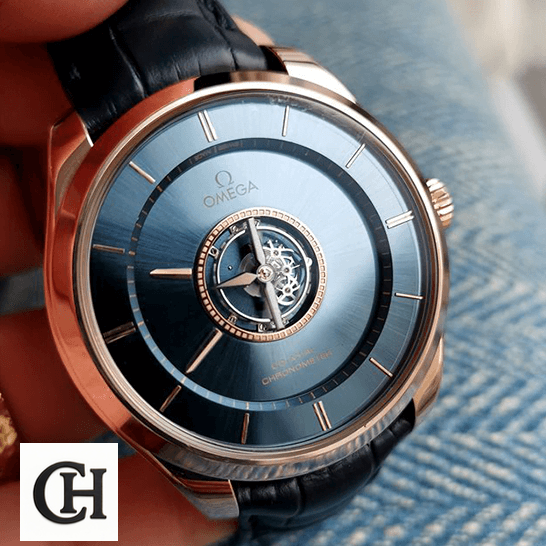 Omega De Ville Tourbillon Co-Axial 4637.31.31 "Tourbillon" Mirror omega 528.53.44.21.03.001 de ville tresor dial Omega Tourbillion Blue Dial Gold Case blue background