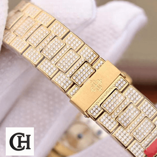 Patek Philippe Nautilus 5711/1A-018 Patek Philippe Diamond Gold Bracelet on the glove white hand