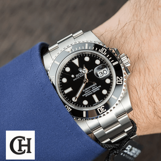 Rolex Submariner 126610LN-0001 Rolex Submariner 116610LN Black Dial on the wrist in a suit