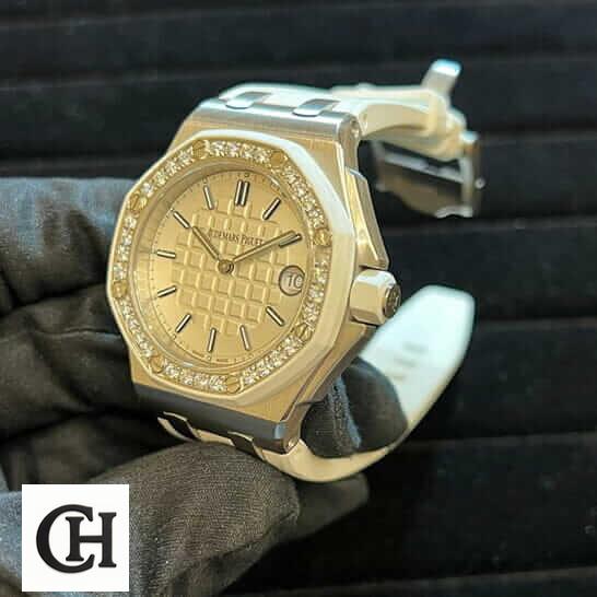 Audemars Piguet Royal Oak 67540SK.ZZ.A010CA.01 AP Royal Oak Diamond Bezel White Dial on the hand & black background