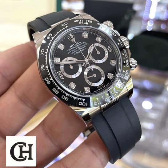 Rolex Daytona Cosmograph 116519LN Rolex Daytona Oysterflex 116519LN Black Rubber Bracelet in their hands