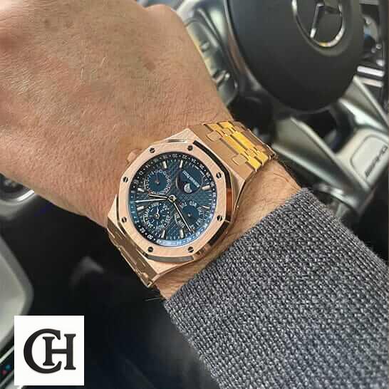 Audemars Piguet Royal Oak Chronograph 26240OR.OO.1320OR.01 Audemars Piguet Royal Oak Blue Dial Gold Case on the man wrist in car