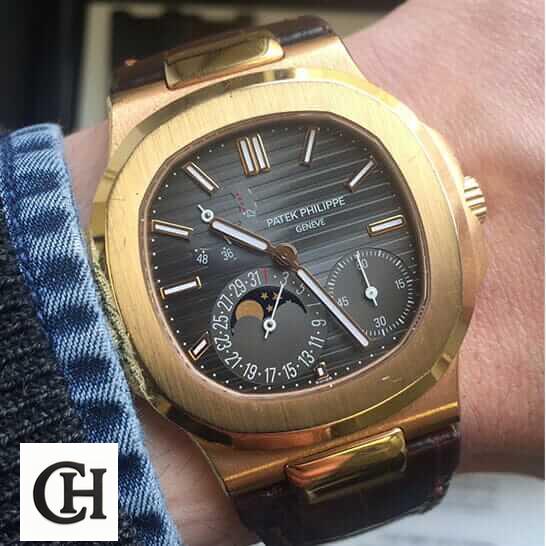 Patek Philippe Nautilus 5712R-001 Patek Philippe Nautilus Black Dial Rose Gold on the man wrist